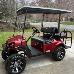 E-Z-GO Express S4 Red Lifted Golf Cart 2017
