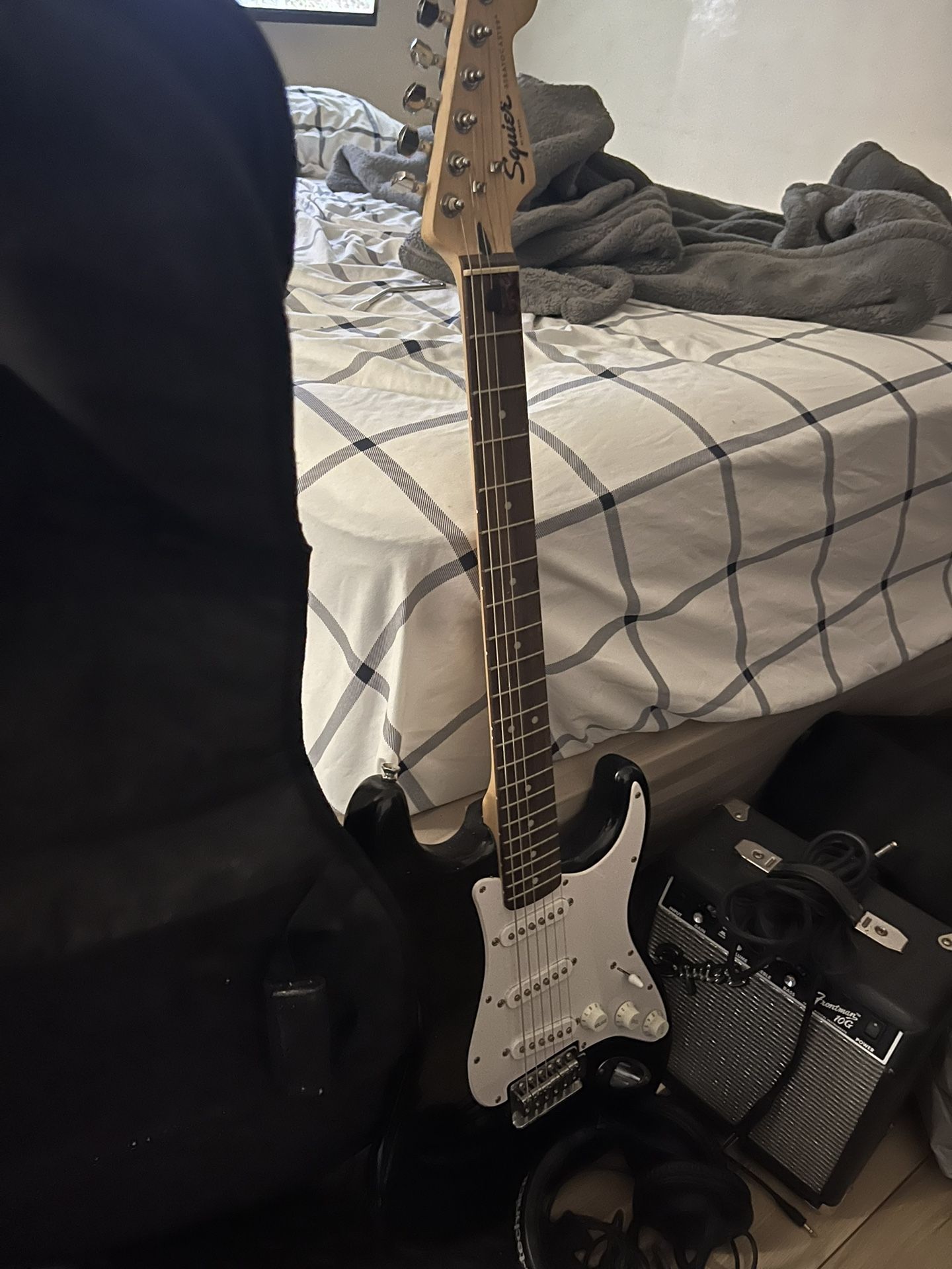 Electric Guitar With Mini-amp And Headphones