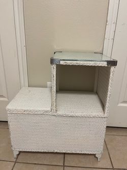 White shelf with storage compartment