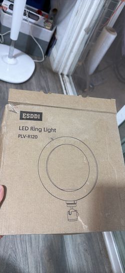 New ESDDI PLV-R120 LED ring light. This item is in its original cardboard packaging and includes a mounting attachment.