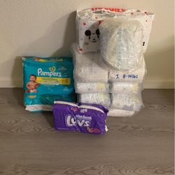 Mixed Pampers. 5 Full Size 1 Diapers,  Two Size 2 Pampers Swaddlers. One Size NB 40 Count 