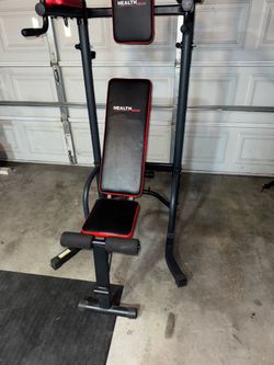 Weight bench, pull up bar power tower bench press, and rowing machine
