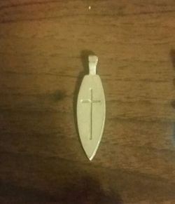 A pendant with a cross in the middle