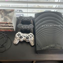 PlayStation 3 (PS3) with 3 Controllers and 8 Games