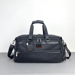 ]TUMI hand-held travel bag