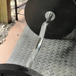 (2) Olympic 35lb Plates (2) Clamps (1) Chrome Hollow Curl Bar 