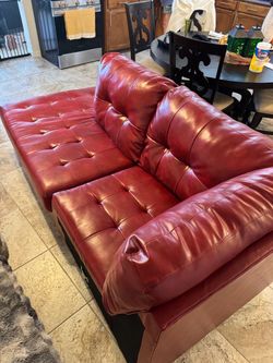 Red leather lounge with ottoman