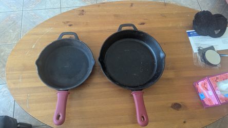 Two cast iron skillet pans