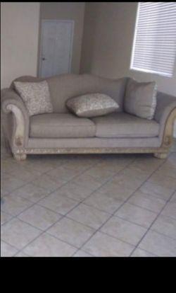 Beige Upholstered Sofa with Carved Wood Frame