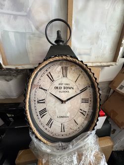 12 in. x 21 in. Black Metal Pocket Watch Style Wall Clock with Rope Accent
