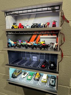 Light-Up Hot Wheels Display Garage – 4 Levels w/ LED Lighting + 27 Hot Wheels Bikes & Cars Included