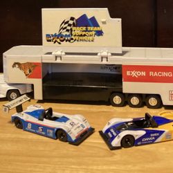 EXXON RACING RELY  ON THE TIGER RACE CAR HAULER WITH LIGHTS AND SOUNDS.