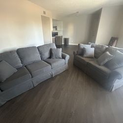 Two Couches With Matching Pillows