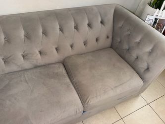 gray tufted 3-seat sofa
