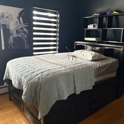 Full size bed 8 drawer on the bed mattress and two black bookcase
