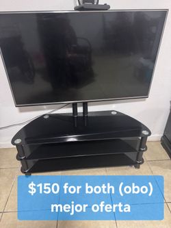 Tv, dresser,microwave,table and chairs and mote