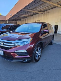 Honda Pilot SUV in Deep Red