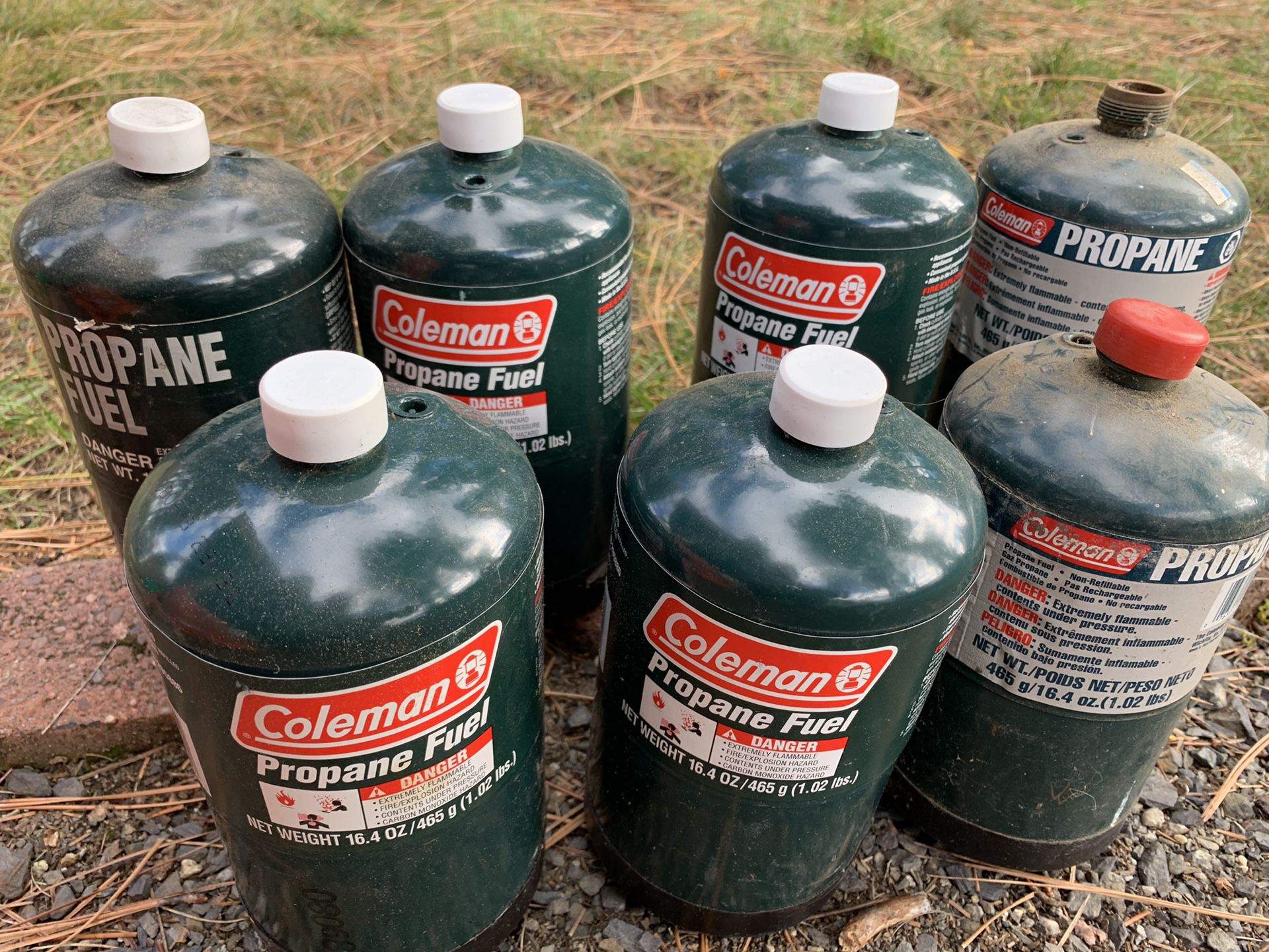 7 Partial cans of propane fuel $10