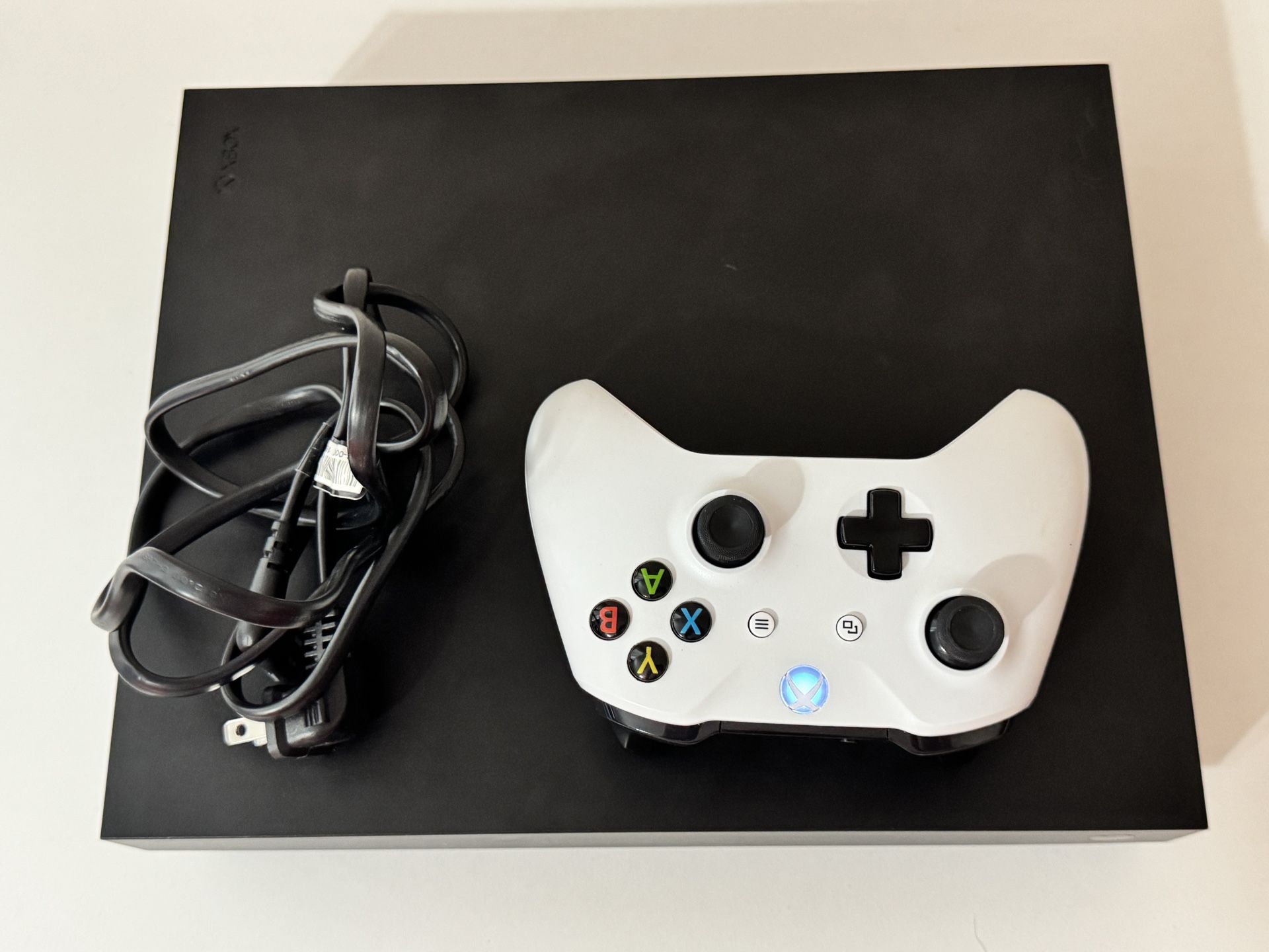 Xbox One X includes 1 Controller HDMI Cable And Power Cord (0 Games Included)