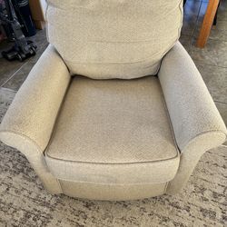 2 beige swivel chairs