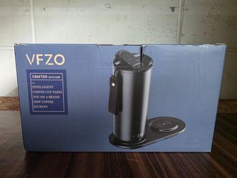 VFZO smart self-heating stainless steel coffee mug and MagSafe charging pad.