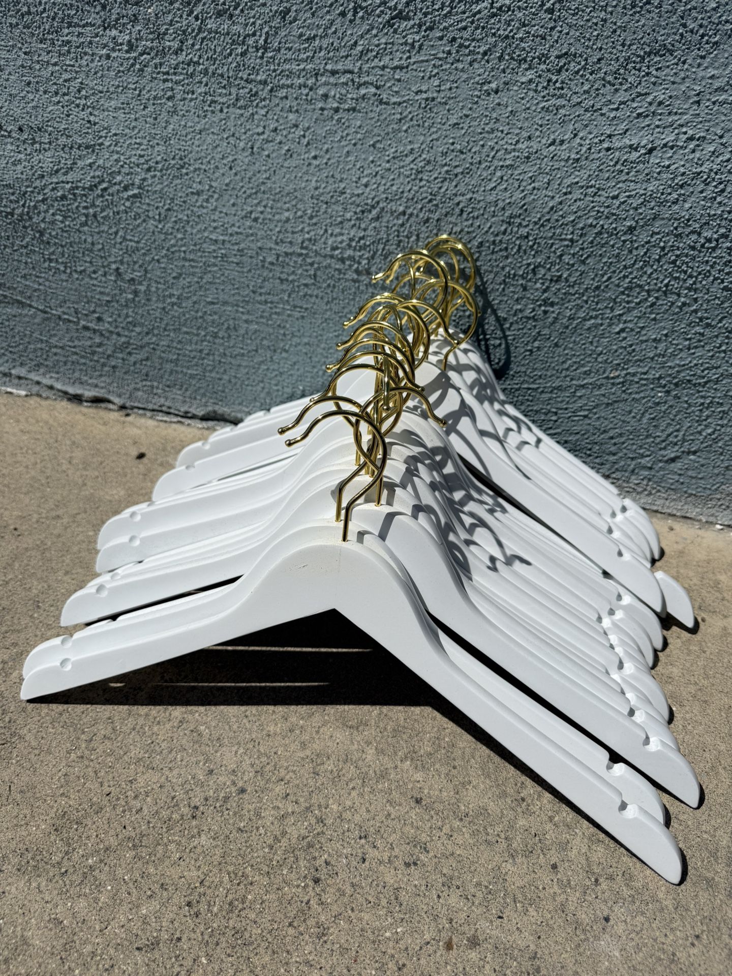 White wooden Hangers With Gold Tips