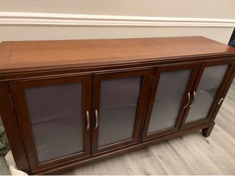 Buffet table with lights inside of cabinet