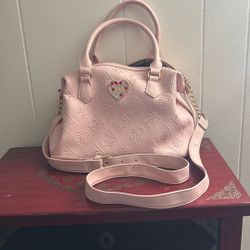 Women’s pink juicy couture bag with arm and hand straps