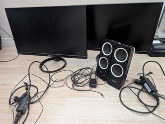 Two 24 inch monitors with speakers