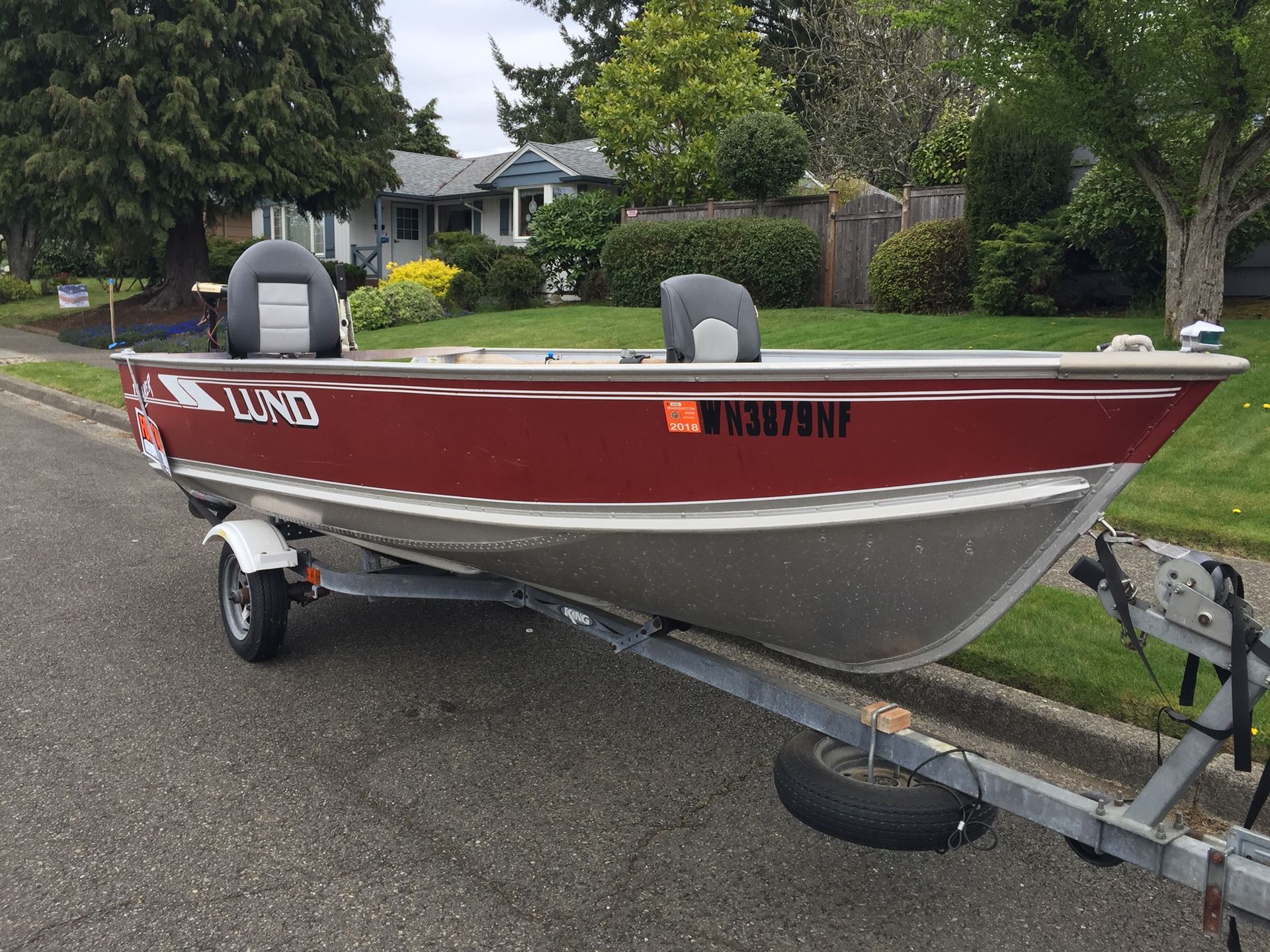 96 Lund Laker 14’ aluminum boat, Suzuki outboard and galvanized king trailer.