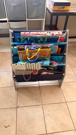 Kids Sling Bookshelf with Navy Fabric Shelves with birthday bags