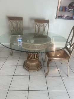 Dining room table has 4 chairs