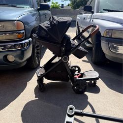 Mom push stroller + toddler riding board