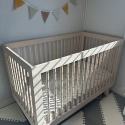 Baby Crib And A Mattress 