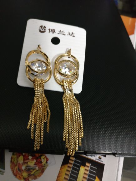 Bold and beautiful gold and single shiny diamond earrings