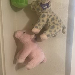 Two step pigs a pink one and a leopard one