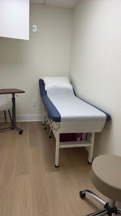 Medical Exam Table with Paper Roll