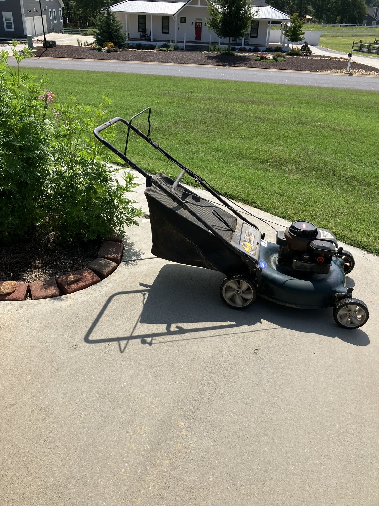 Perfect running push lawnmower with bag starts on the first pull,,I even accept, broken mowers traded in.