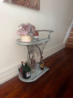 modern chrome and frosted glass rolling bar cart/serving cart.