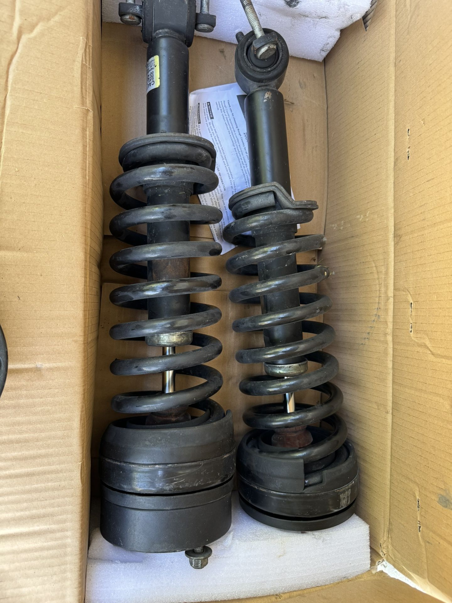 Stock Ford F-150 Shocks and 2.5 Kyx Leveling Pucks