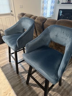 2 blue barstool chairs