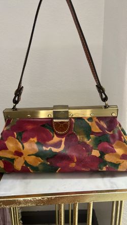 Patricia Nash Bloom Romance leather shoulder bag featuring a vibrant floral print and vintage-style metal clasp