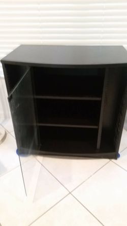 Black entertainment unit, with glass doors 2 shelf and 2 CD towers hold up to 80 ADd and 3 side shelf storage