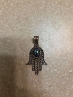 Sterling Silver pendant.  Made in Israel.  Weight is 2.4 grams