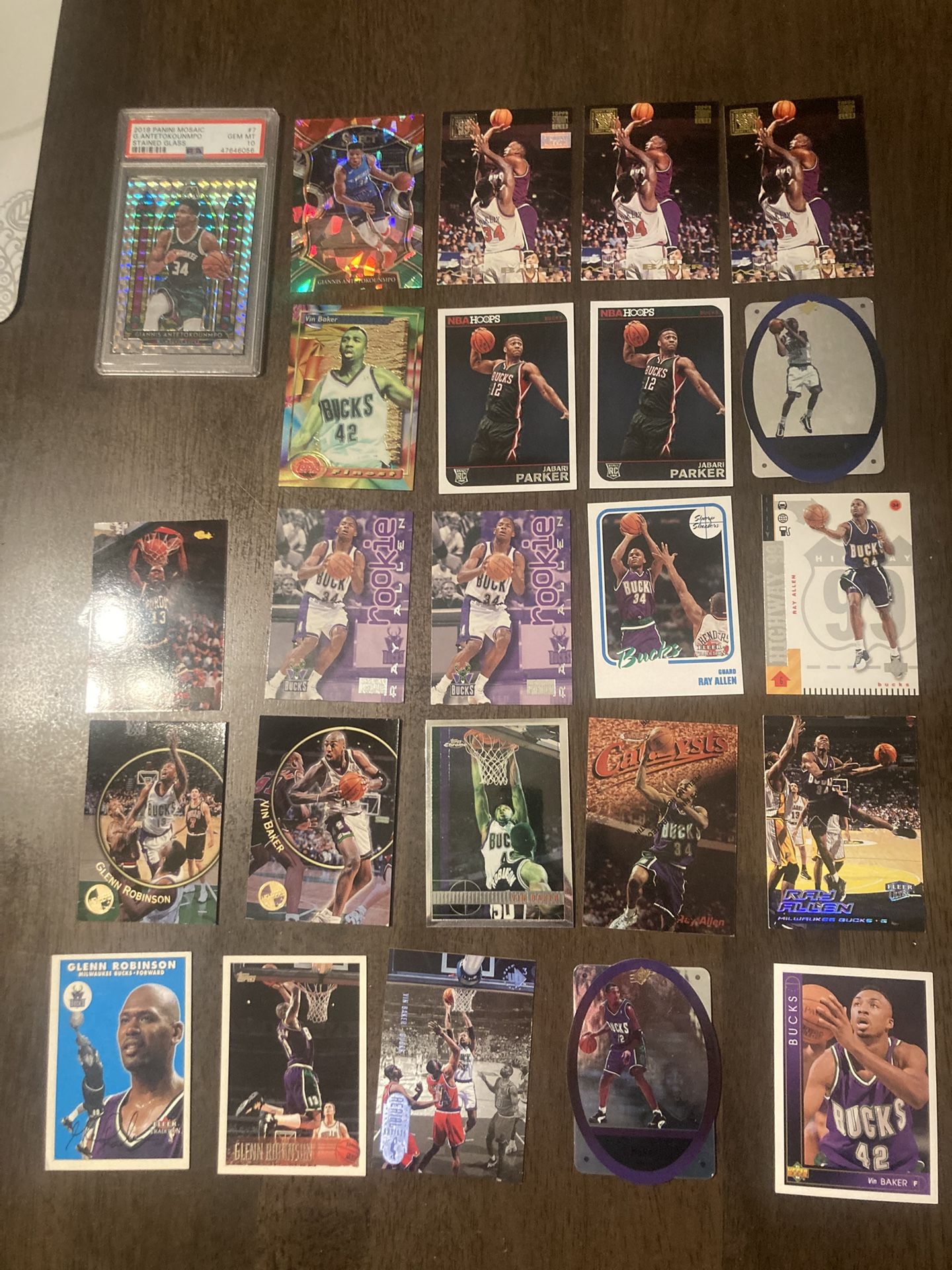 Lot Of 60 Milwaukee Bucks Cards. The highlight of this lot is a Giannis Antetokounmpo 2019 Panini Mosaic Stained Glass PSA 10