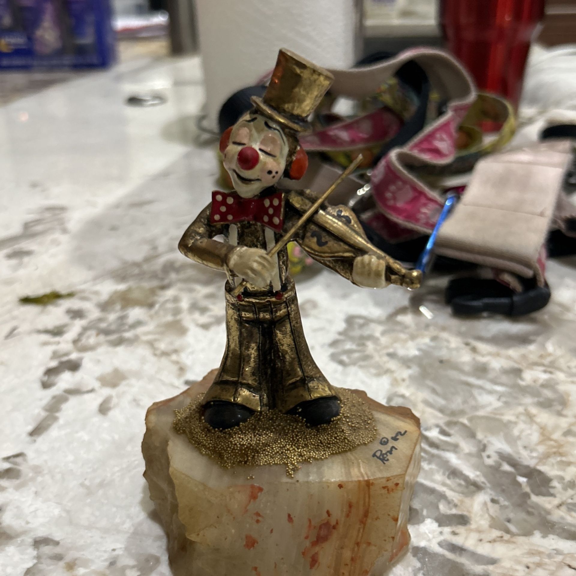 Ron Clown Playing Violin On Marble Base