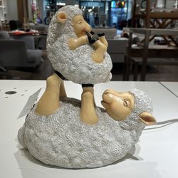 Reduced Momma Sheep Lifting Baby Sheep (Baby missing left ear)