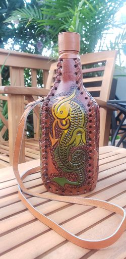 Glass bottle wrapped in leather