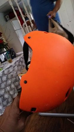 Bright neon orange skater helmet. Chula vista; D and Broadway