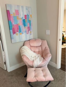 Light pink velvet lunge chair w/ ottoman and large artwork